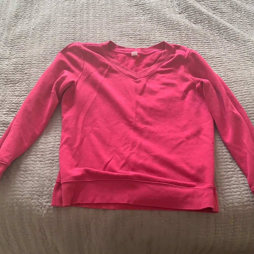Pink sweater.